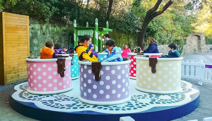 Children enjoying teacup ride at Tibidabo Amusement Park, Barcelona.