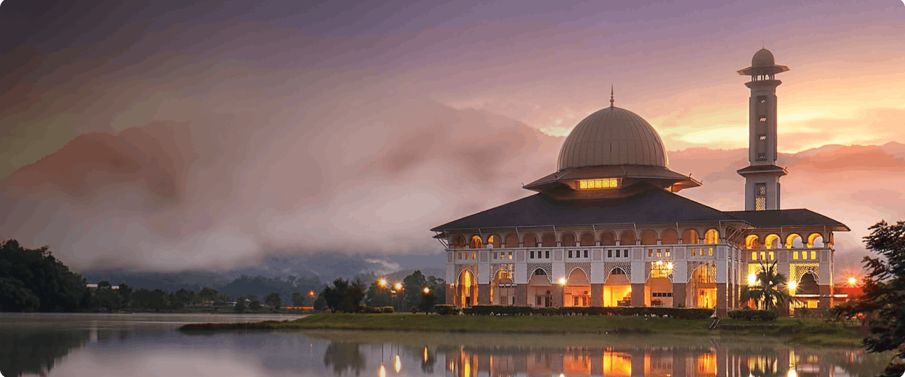 Mosque by a lake at sunset in Selangor, Malaysia.