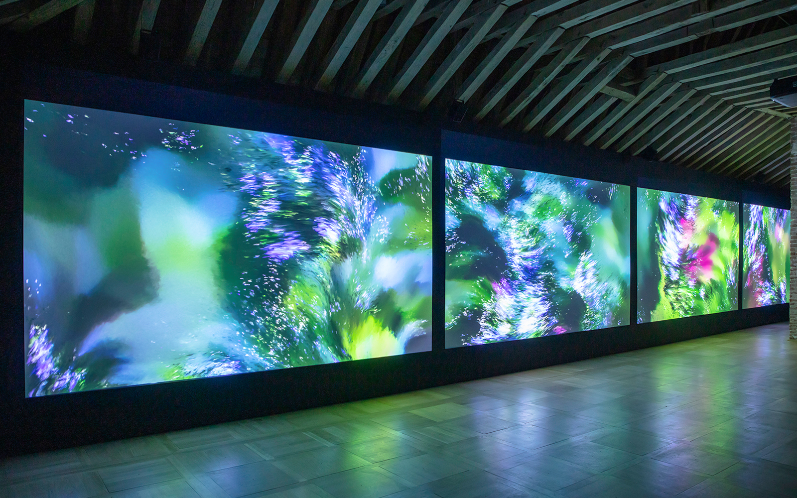 Digital art installation at Chaumont sur Loire Castle, featuring vibrant abstract visuals.
