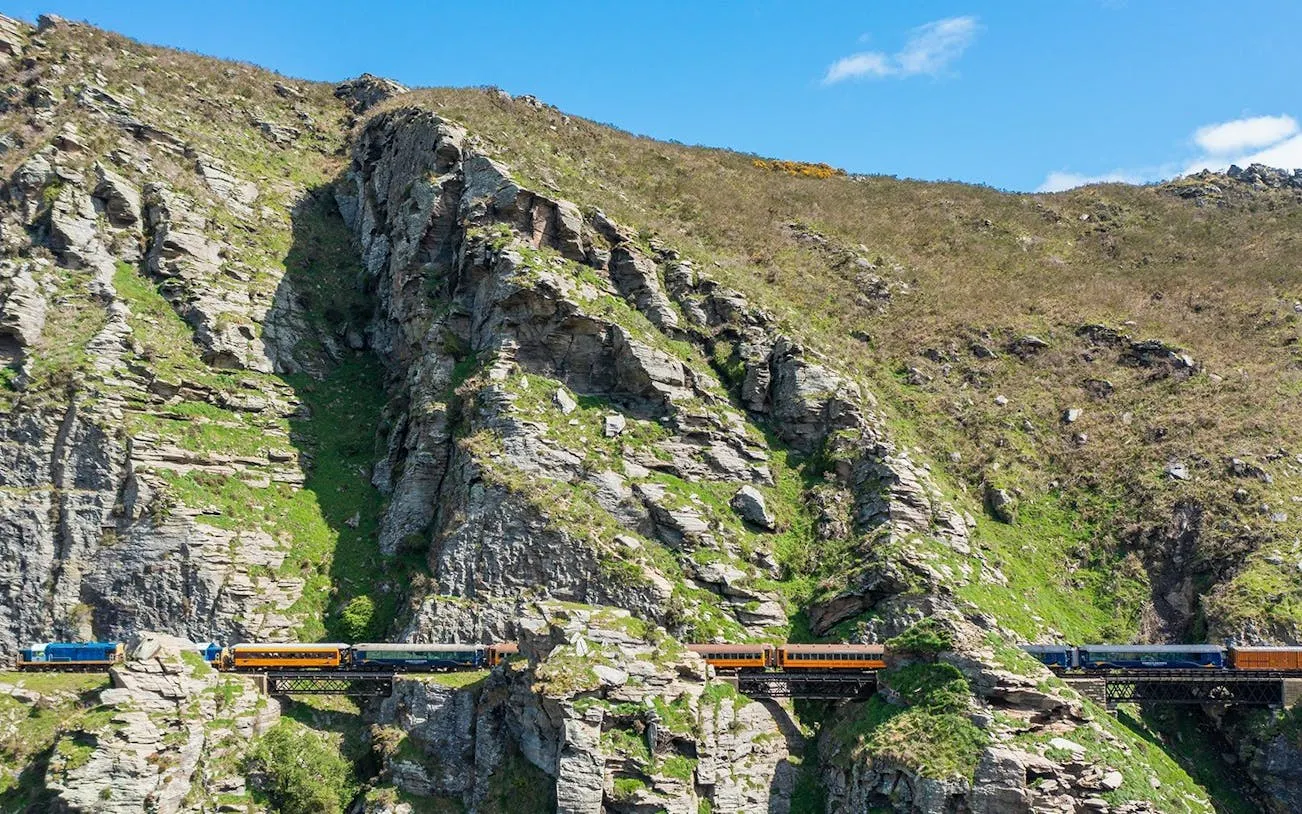 Train crossing Deep Stream Bridge on Taieri Gorge Scenic Rail Journey, New Zealand.