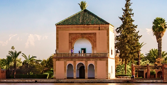 Menara Gardens pavilion by a reflective pool in Marrakech, Morocco.