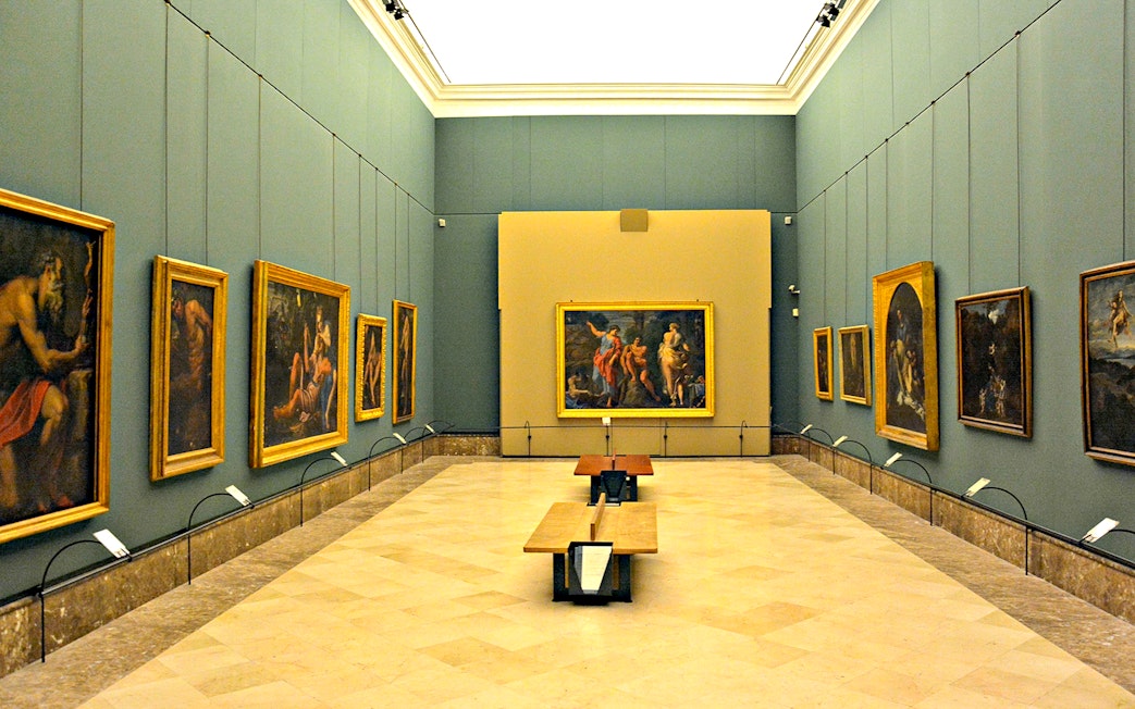Art gallery with classic paintings on display during Capodimonte small group tour.