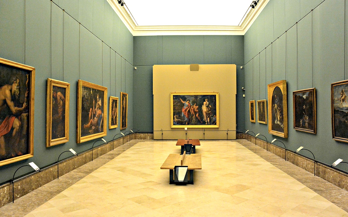 Art gallery with classic paintings on display during Capodimonte small group tour.