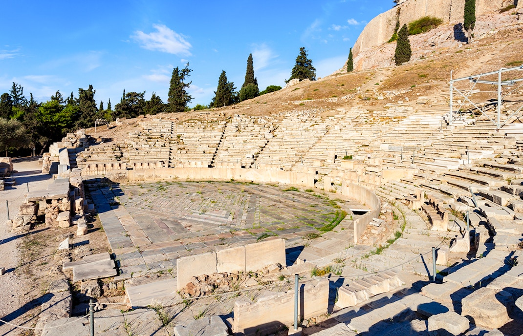 Theatre of Dionysus seating at Acropolis, showcasing ancient stone tiers.