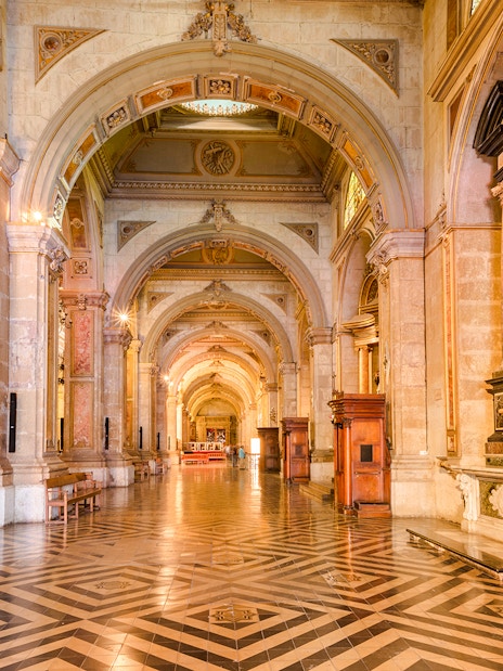 Santiago Cathedral interior with ornate arches and detailed artwork.