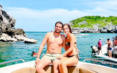 Couple on speedboat during Koh Samui Ang Thong day tour with snorkeling and kayaking.