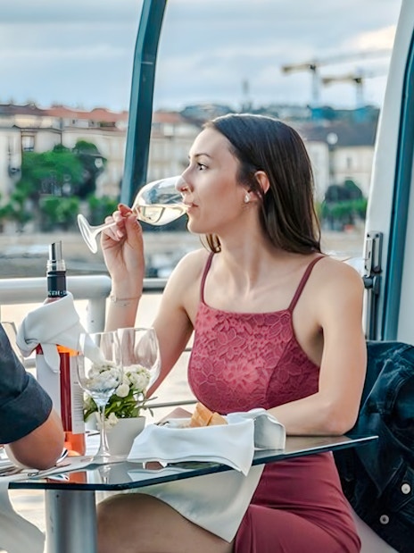 Couple enjoying a candlelit dinner on a Budapest river cruise.
