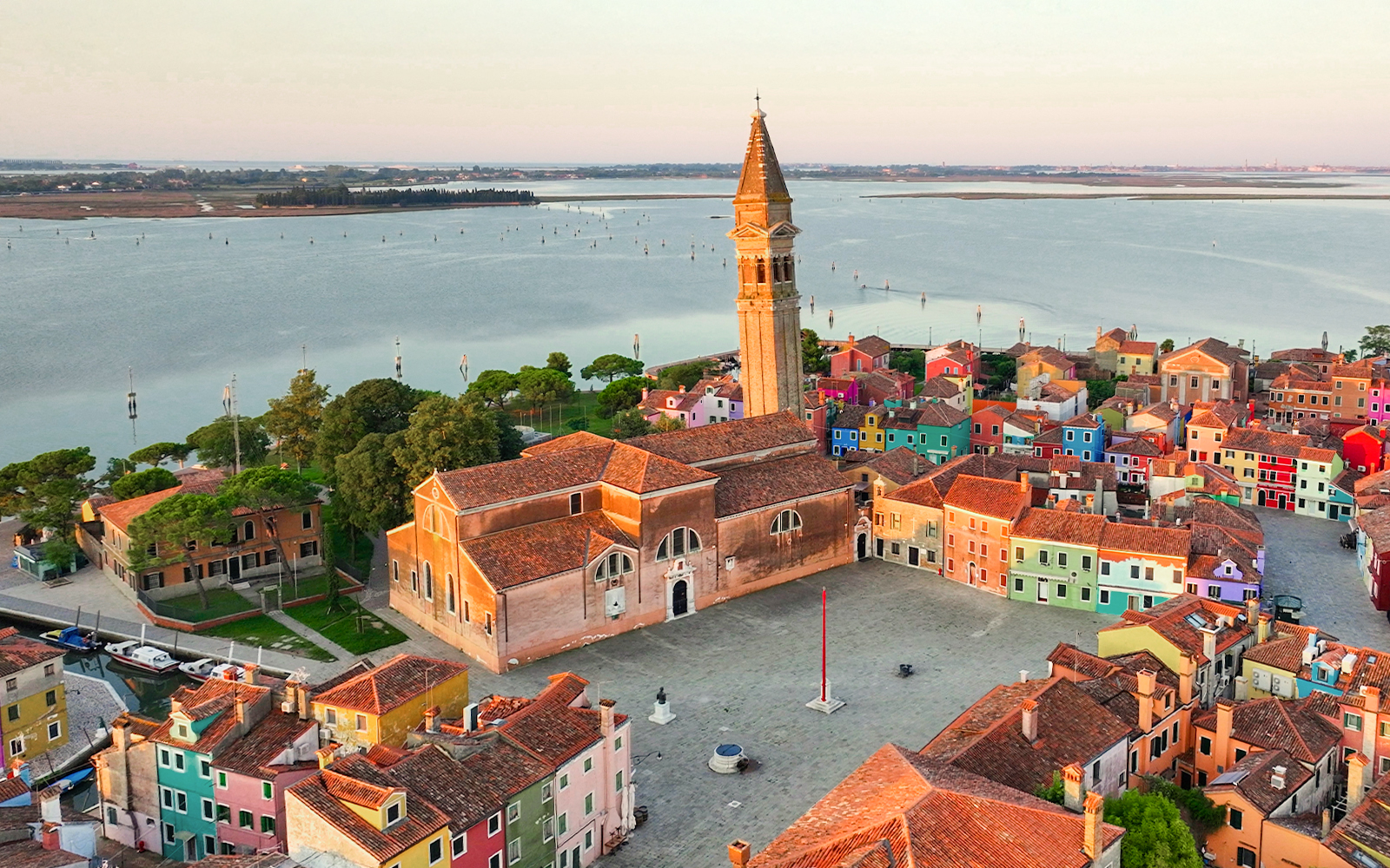 Aerial view of Church of Saint Martin Bishop in Venice, showcasing its architectural design and surrounding landscape.
