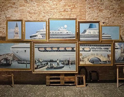 Framed artwork of cruise ship and gondolas at Banksy Museum Amsterdam.