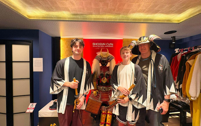 Visitors in samurai attire at Shogun Cafe, Tokyo, during Asakusa Electric Go Kart tour.