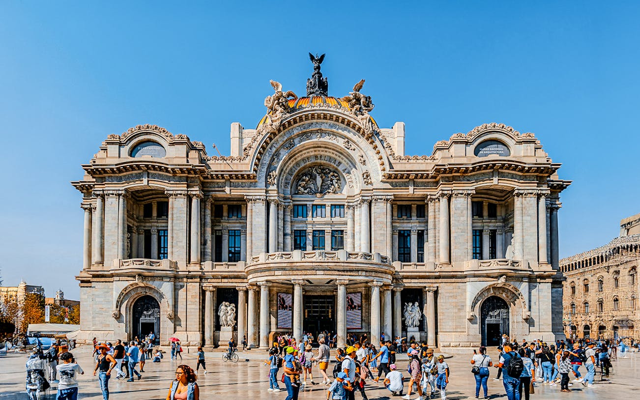 Tourists outside the Palace of Fine Arts in Mexico City.