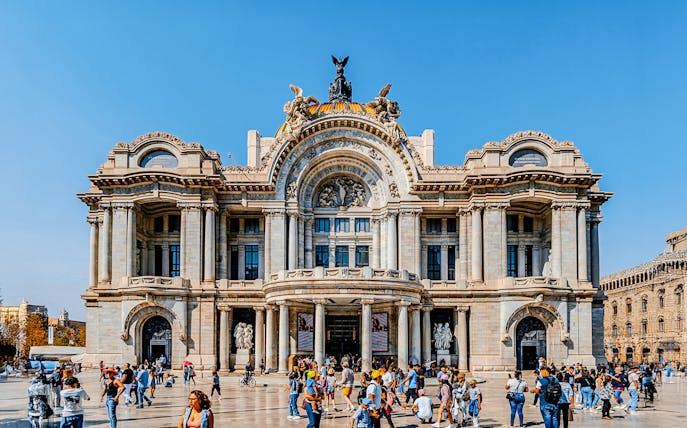 Tourists outside the Palace of Fine Arts in Mexico City.