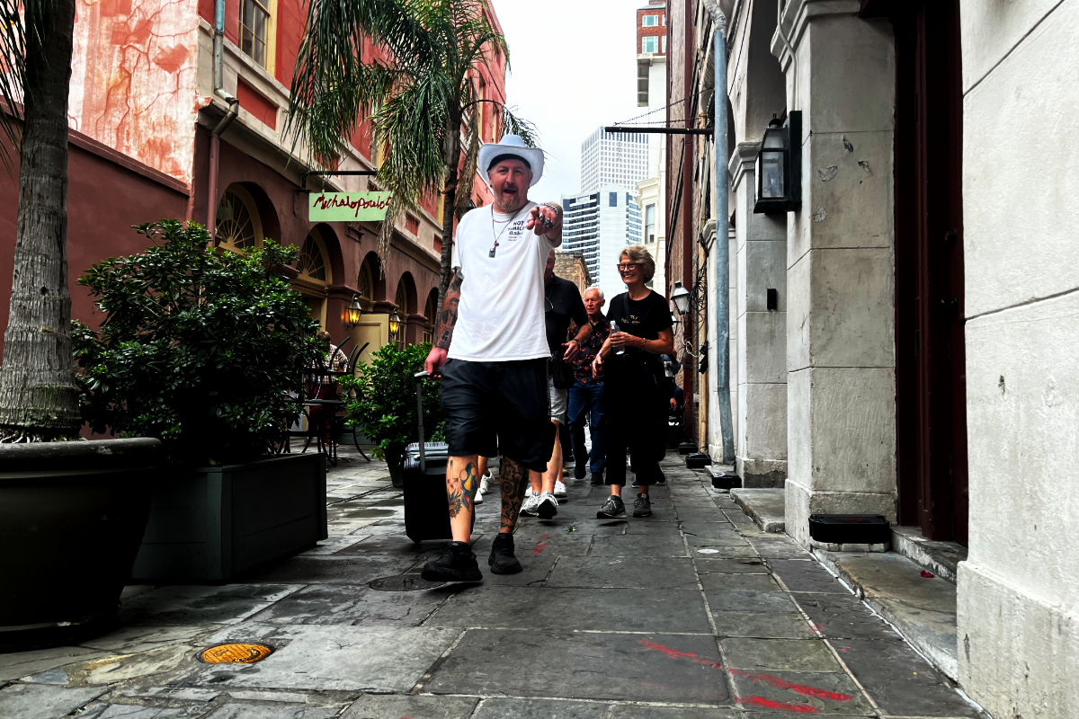 Guided tour group exploring haunted sites in New Orleans, featuring ghost, voodoo, and vampire stories.