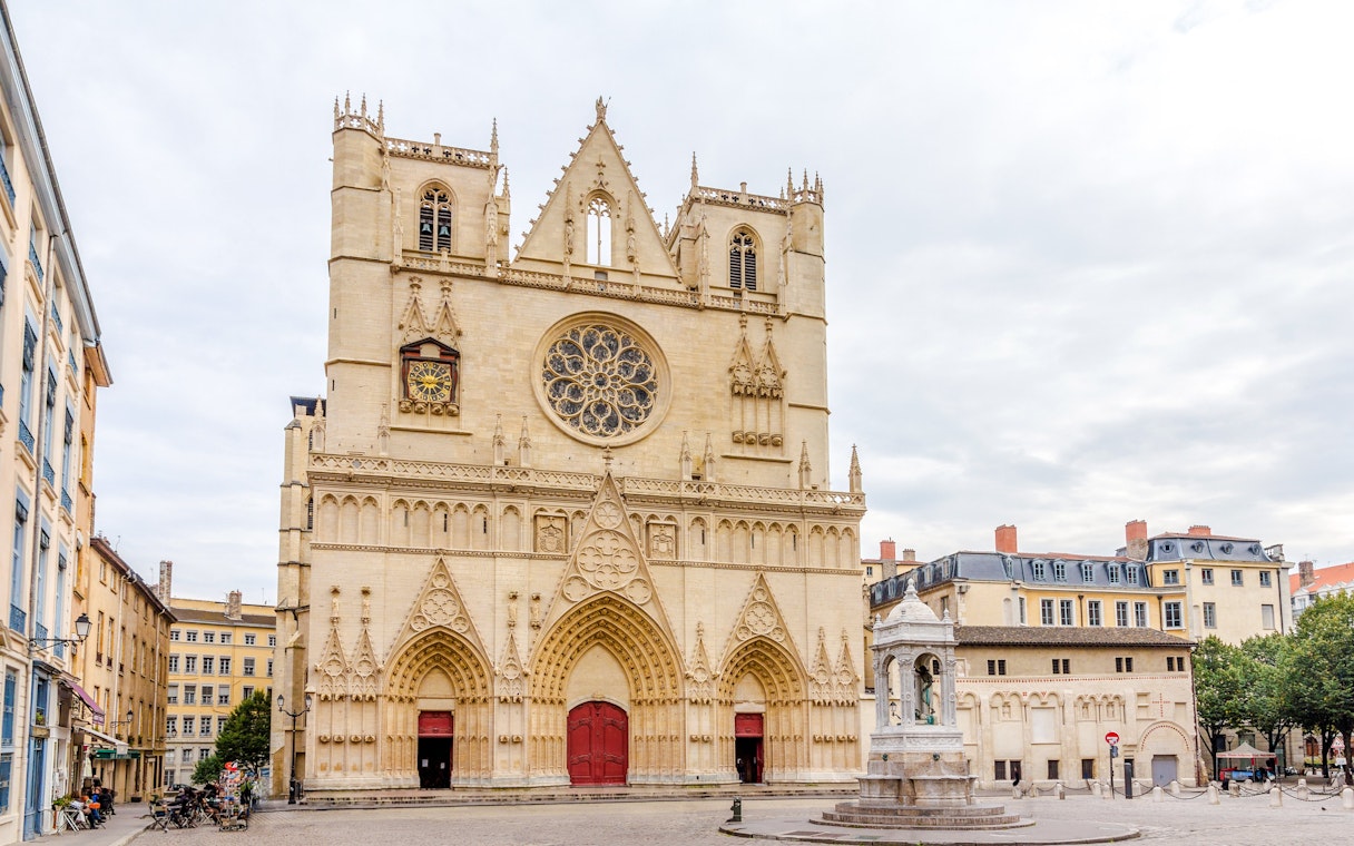 Cathedrale Saint Jean-Baptiste de Lyon facade with intricate carvings and rose window, Lyon, France.