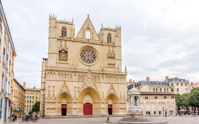 Cathedrale Saint Jean-Baptiste de Lyon facade with intricate carvings and rose window, Lyon, France.