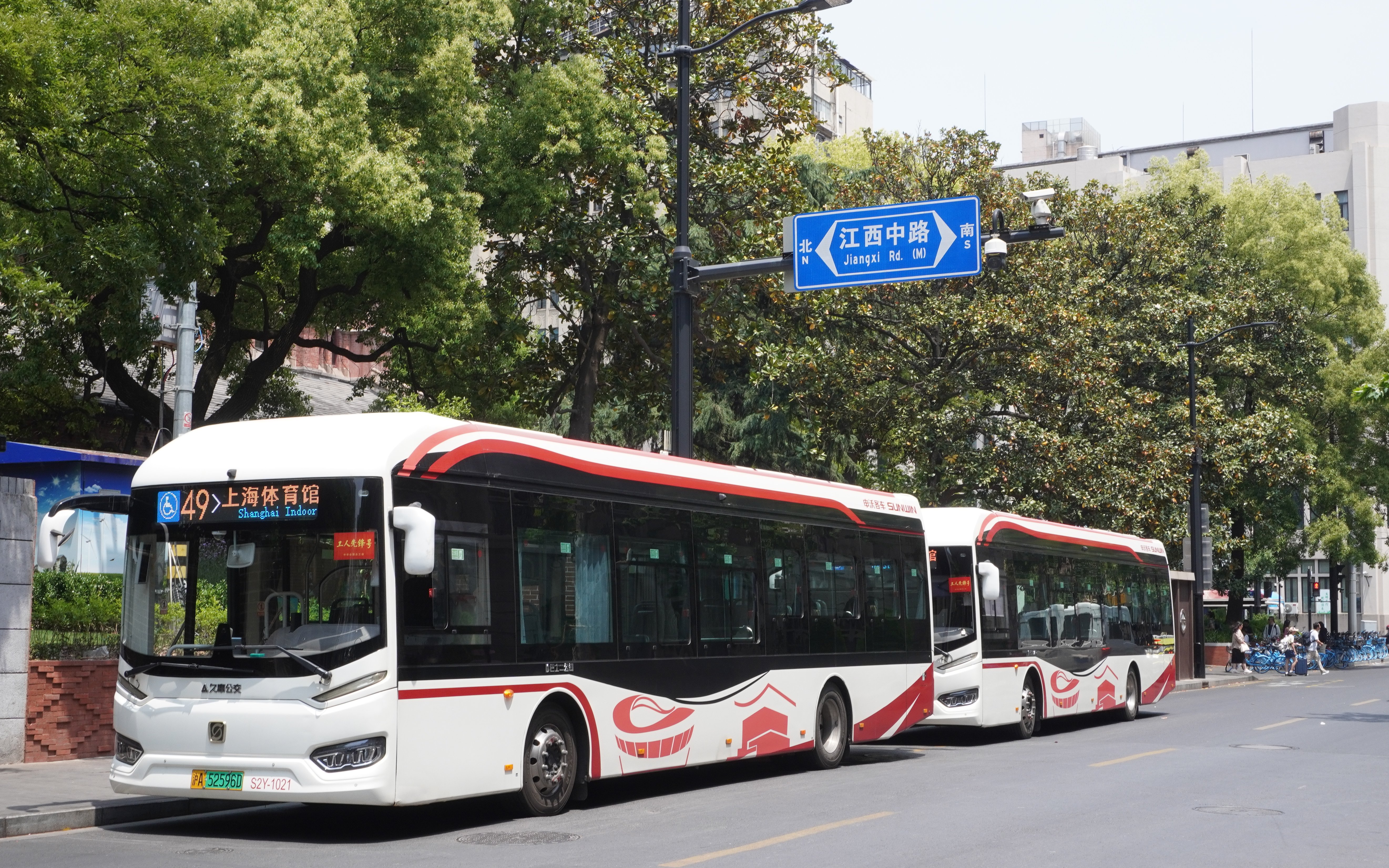 Buses at Jiangxi Road bus stop in Shanghai, China.
