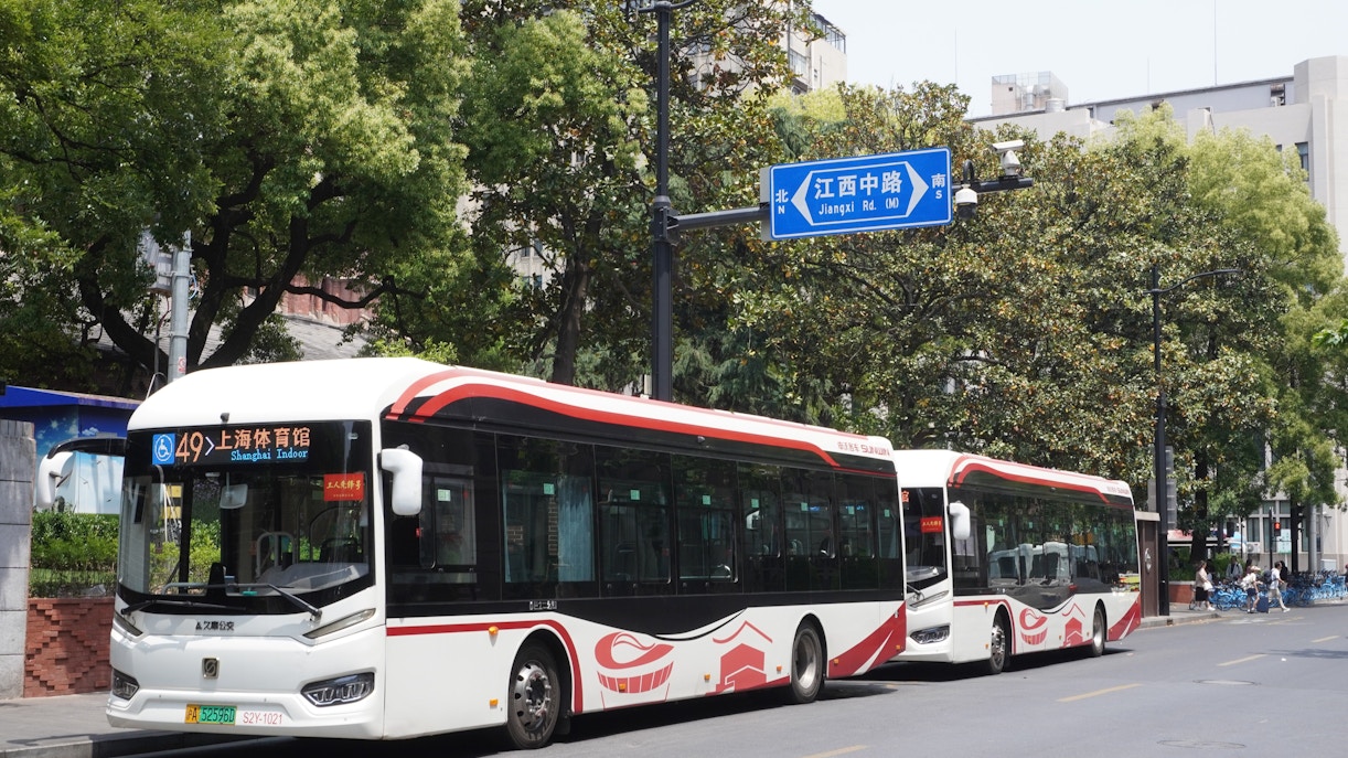 Buses at Jiangxi Road bus stop in Shanghai, China.