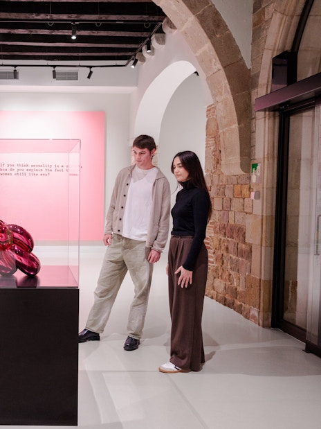 Visitors viewing modern art sculpture at Moco Museum Barcelona.