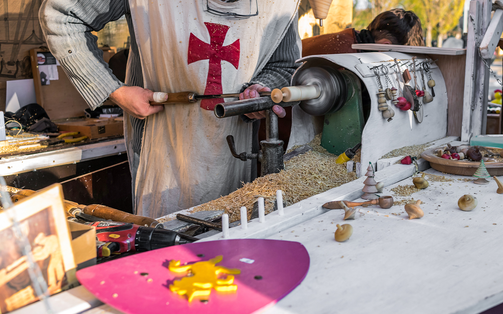 Vic Medieval Market stalls with visitors in Barcelona, showcasing local crafts and produce.