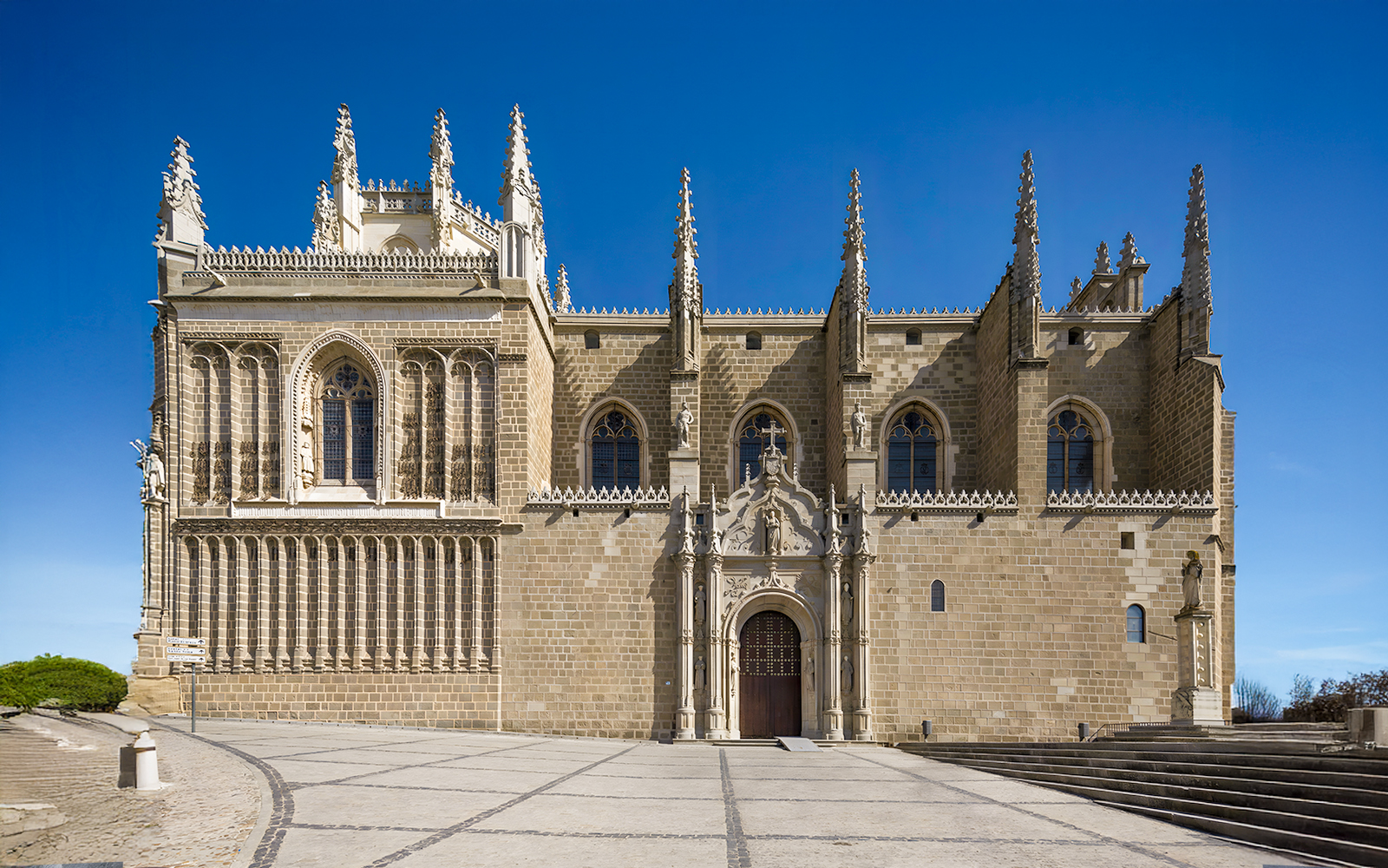 Monastery of San Juan de los Reyes exterior with Gothic architecture in Toledo, Spain.
