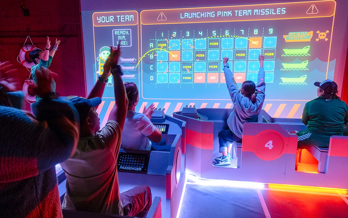 Participants engaging in an interactive game at the Squid Games experience in London.