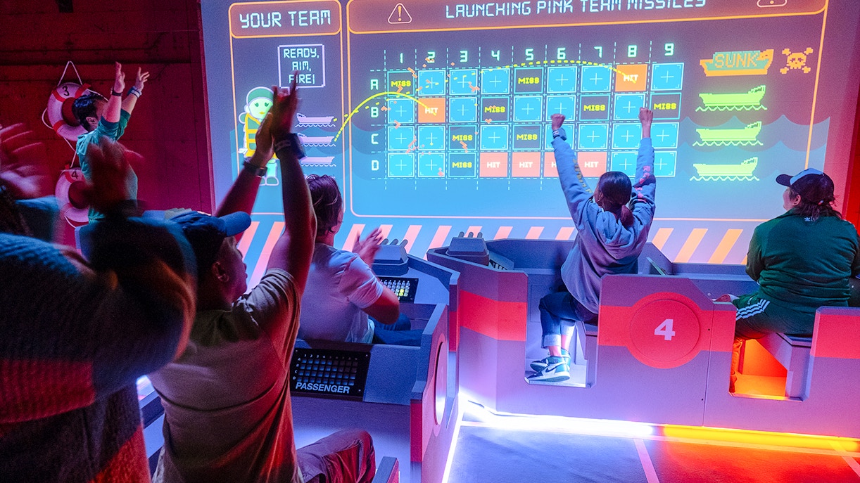 Participants engaging in an interactive game at the Squid Games experience in London.