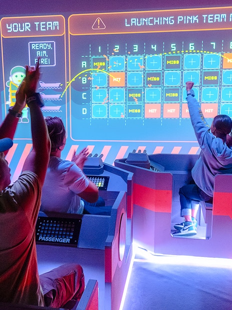 Participants engaging in an interactive game at the Squid Games experience in London.