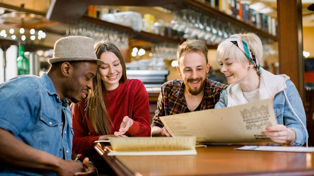 Friends ordering food at a cafe.