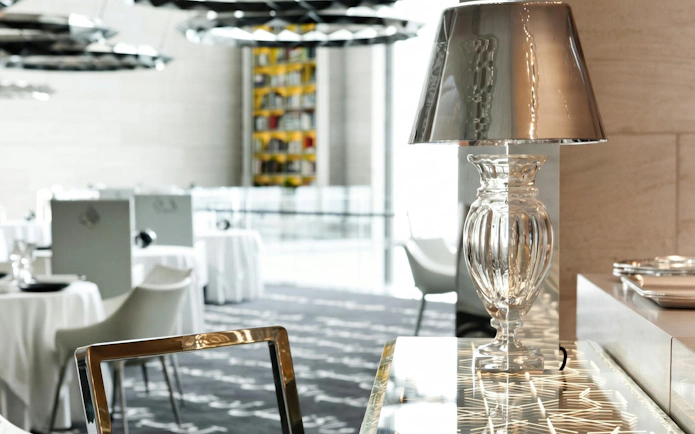 Interior of Museum of Islamic Art restaurant in Doha with elegant table settings.