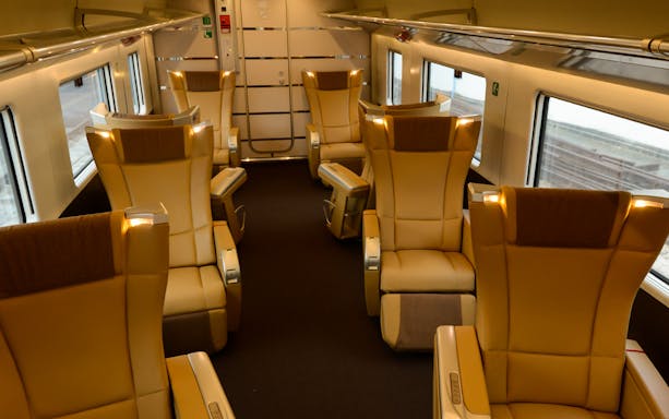 Luxurious seating inside an Italian train carriage.