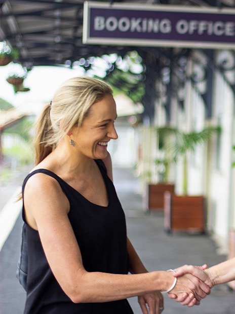 Mary Valley Rattler staff greeting a passenger at the booking office.