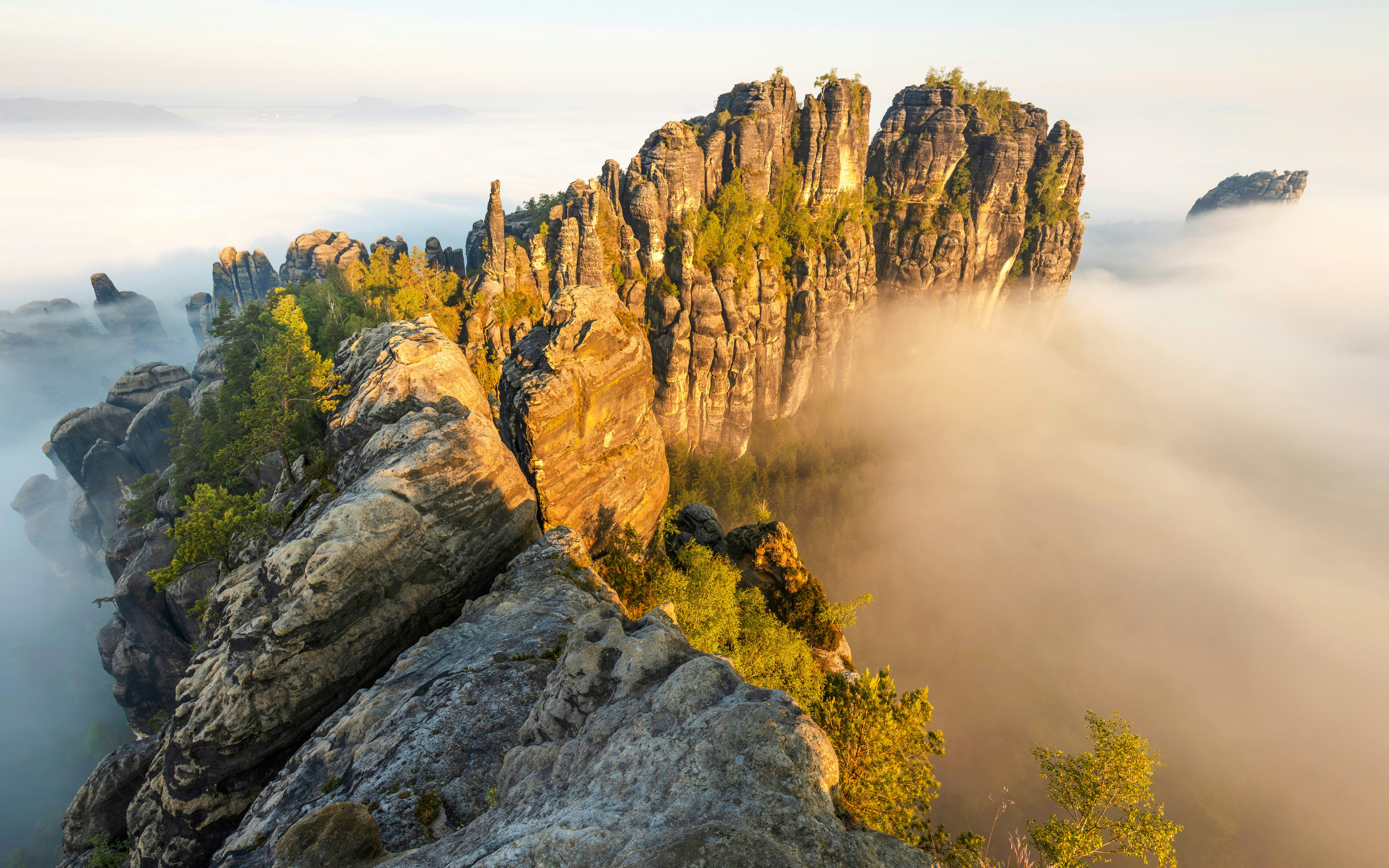 Sunrise over Schrammsteine rock formations in Saxon Switzerland, Germany.