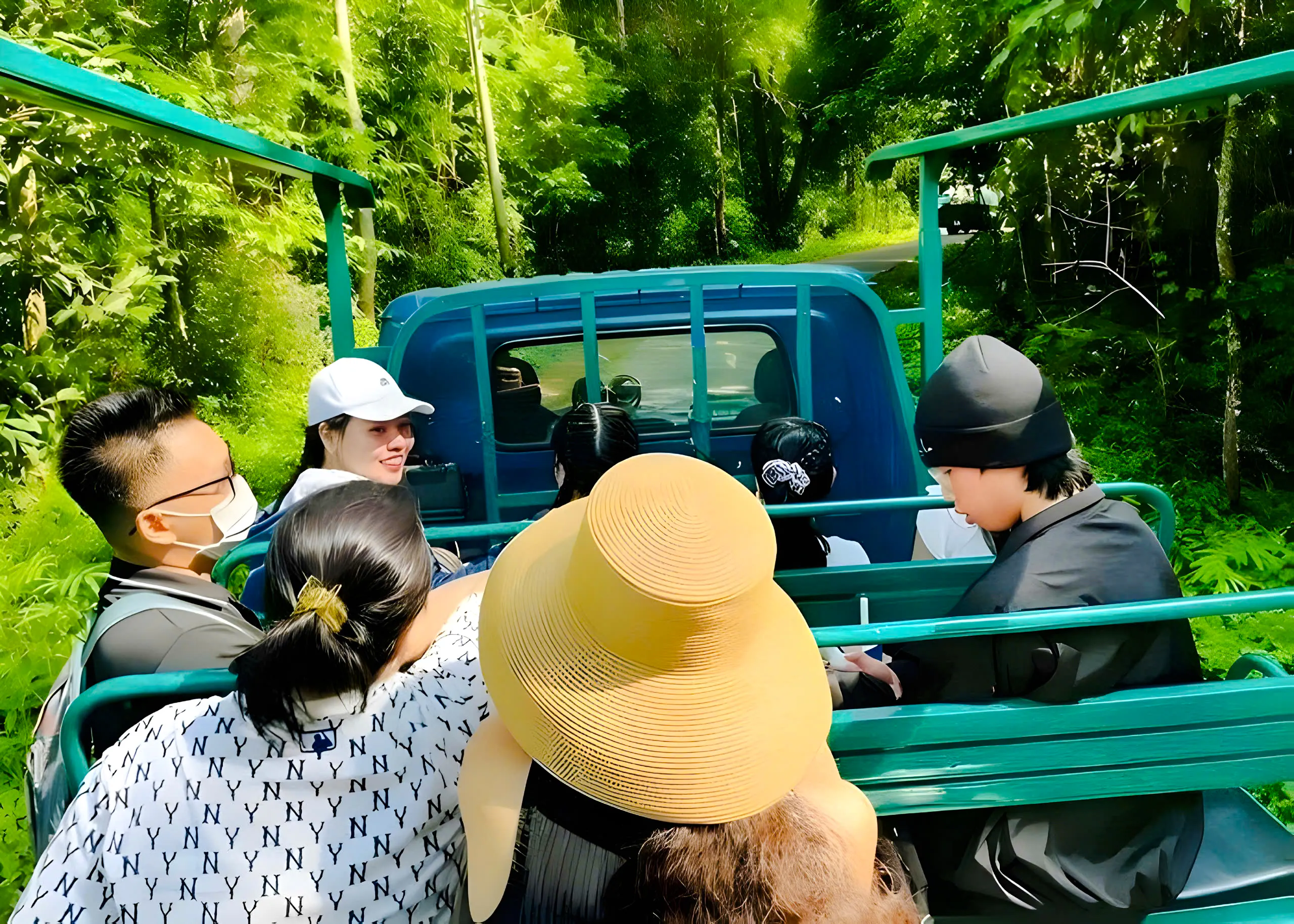 Tourists on a jungle vehicle ride through Nam Cat Tien National Park, Vietnam.