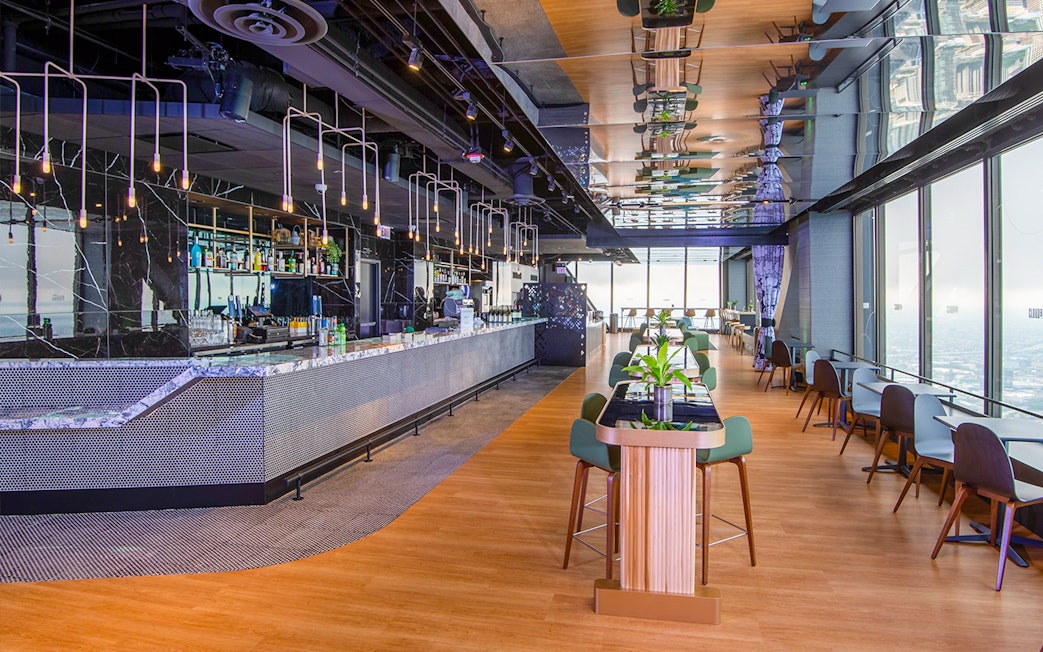 Cloud bar interior at Chicago's 360 Observation Deck with city views.