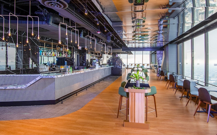Cloud bar interior at Chicago's 360 Observation Deck with city views.