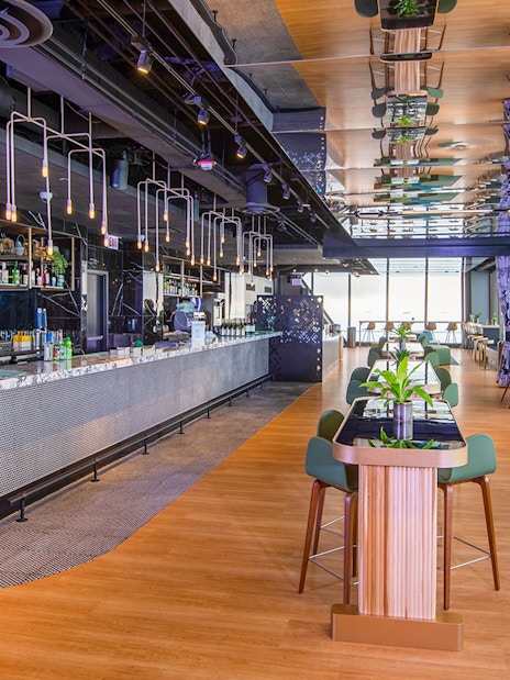 Cloud bar interior at Chicago's 360 Observation Deck with city views.