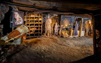 Hallstatt Salt Mine exhibit with historical figures and artifacts, part of Salzburg private tour.