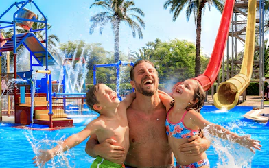 Family enjoying water play area at Aquopolis Torrevieja mini park.