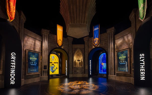 Hogwarts house banners at Harry Potter™: The Exhibition entrance.