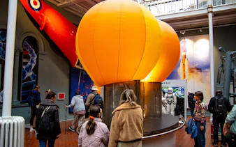 Visitors exploring the space exhibit at the National Museum of Scotland in Edinburgh.