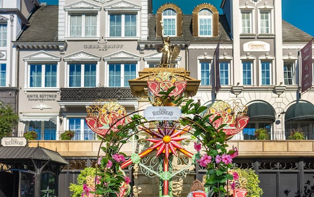 Bolles Riesenrad entrance with floral arch in Berlin theme park, Phantasialand.