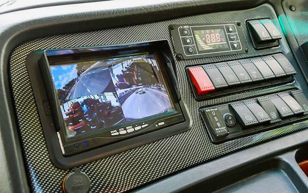 Dashboard view of Limo Bus Express with camera display, Suvarnabhumi Airport to Bangkok Silom route.