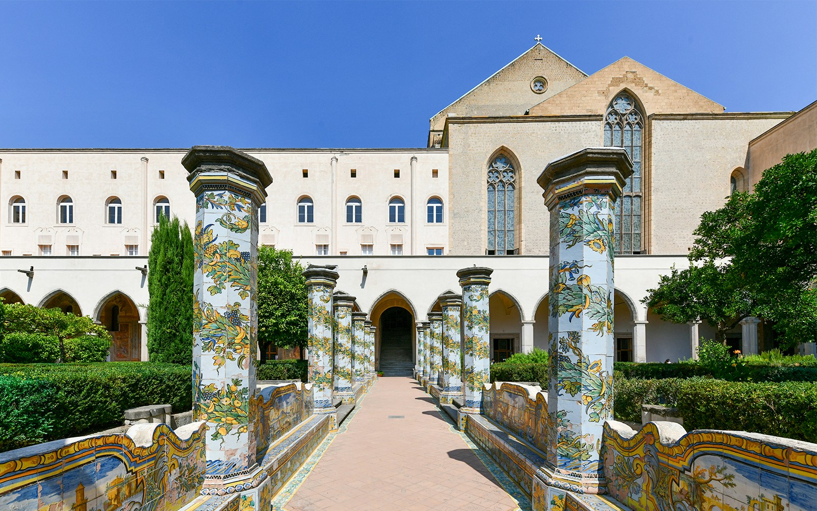 Complesso Monumentale di Santa Chiara courtyard with historic architecture in Naples, Italy.