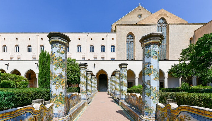 Complesso Monumentale di Santa Chiara courtyard with historic architecture in Naples, Italy.