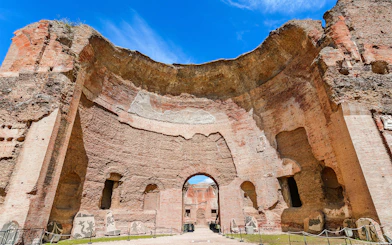 Baths of Caracalla ancient ruins with arches in Rome, Italy.