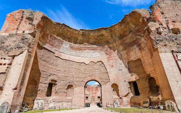 Baths of Caracalla ancient ruins with arches in Rome, Italy.