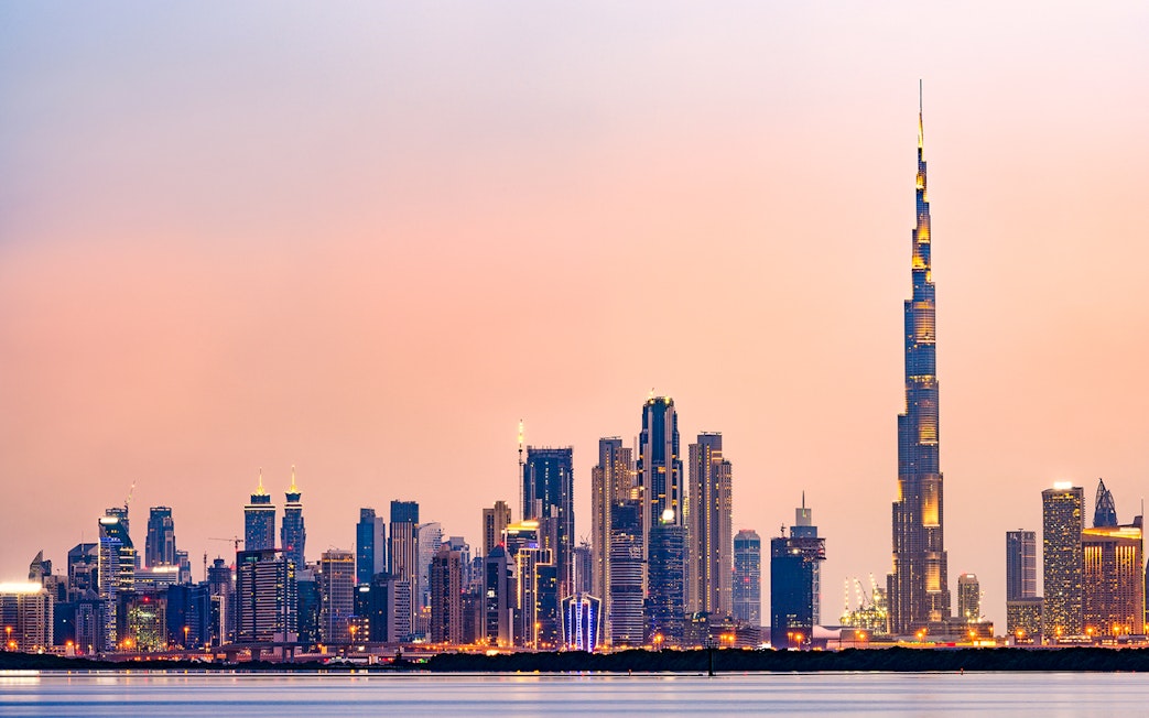 Dubai skyline with Burj Khalifa at sunset.