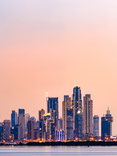 Dubai skyline with Burj Khalifa at sunset.