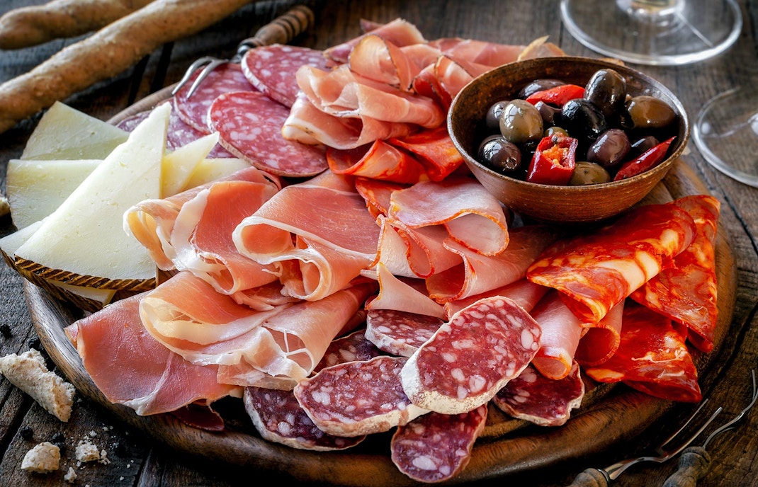 Spanish tapas assortment with olives and cured meats