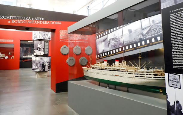 Model ship display at Galata Museo del Mare, Genoa, featuring Andrea Doria exhibit.